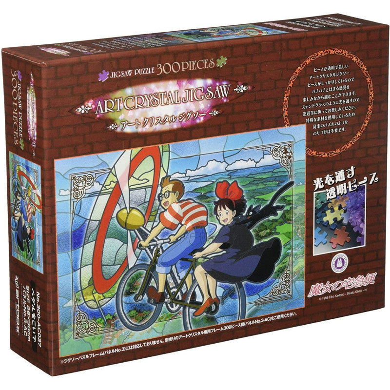 PUZZLE VITRAIL 300P TOMBO & KIKI SUR LE VÉLO À HÉLICE - KIKI LA PETIT