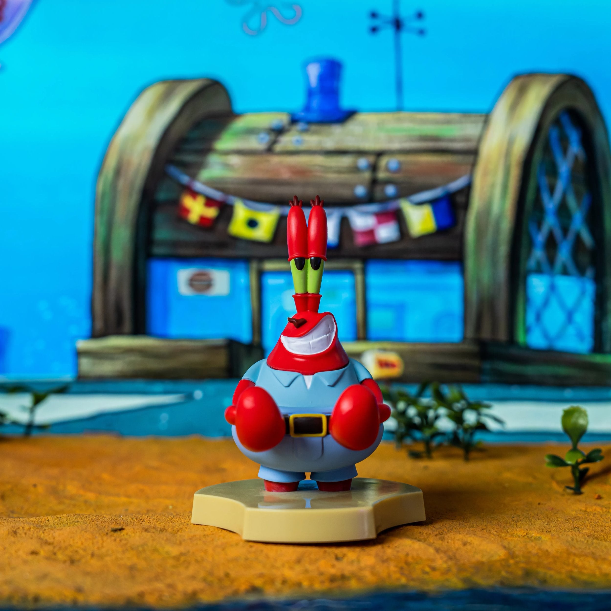 Cable Guys Holdems - Bob l'éponge - Support pour écouteurs et téléphone M. Krabs - flash vidéo